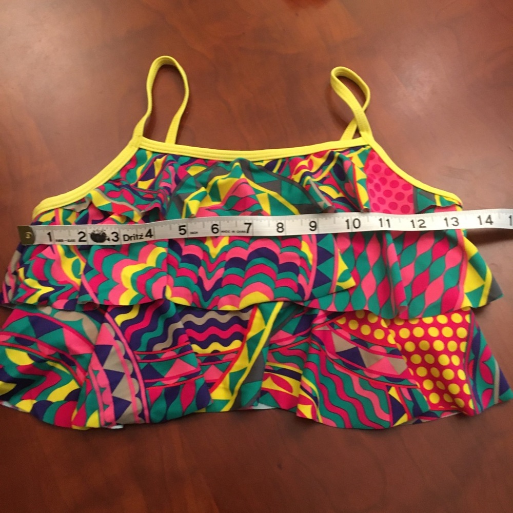 Girl’s swimwear vibrant colored tiered top.